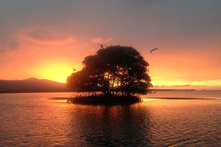 a sunset over a body of water